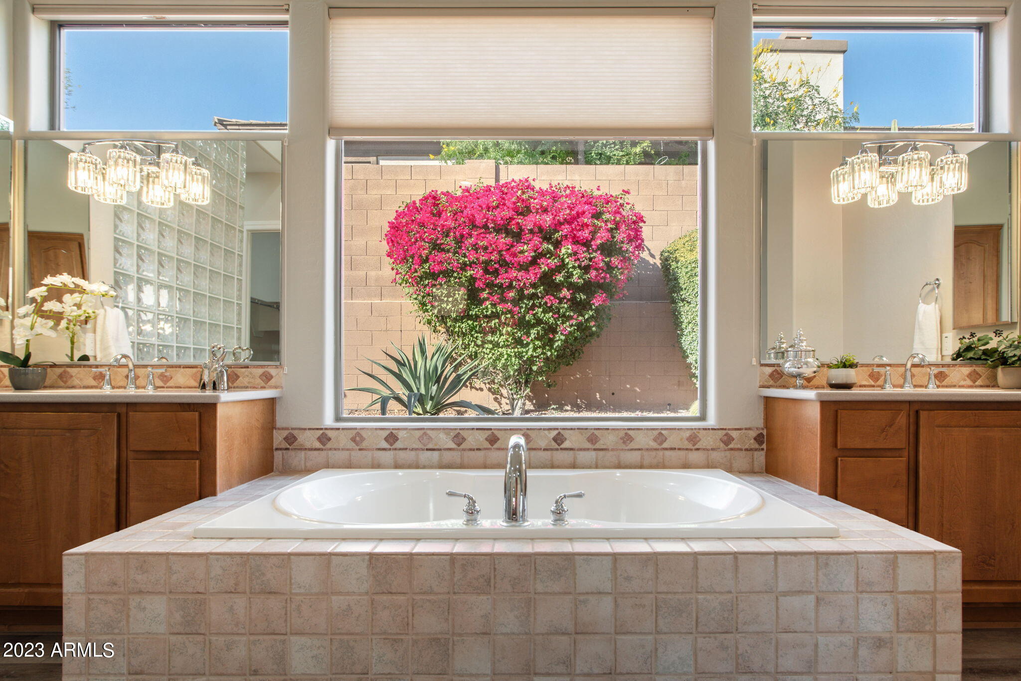 42409 North Back Creek Way Anthem, AZ 85086 - Photo 28 of 87 a bath tub sitting in a bathroom next to a window