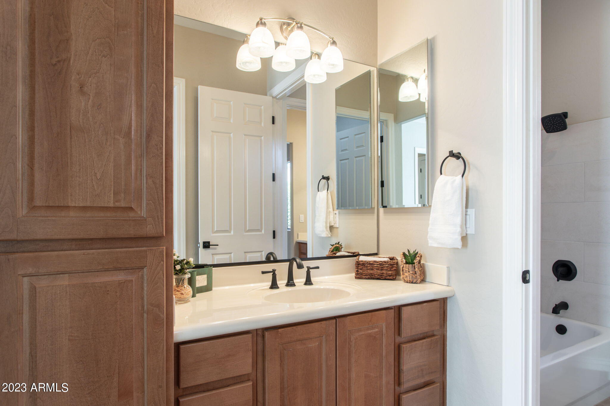 42409 North Back Creek Way Anthem, AZ 85086 - Photo 36 of 87 a bathroom with a sink vanity and mirror