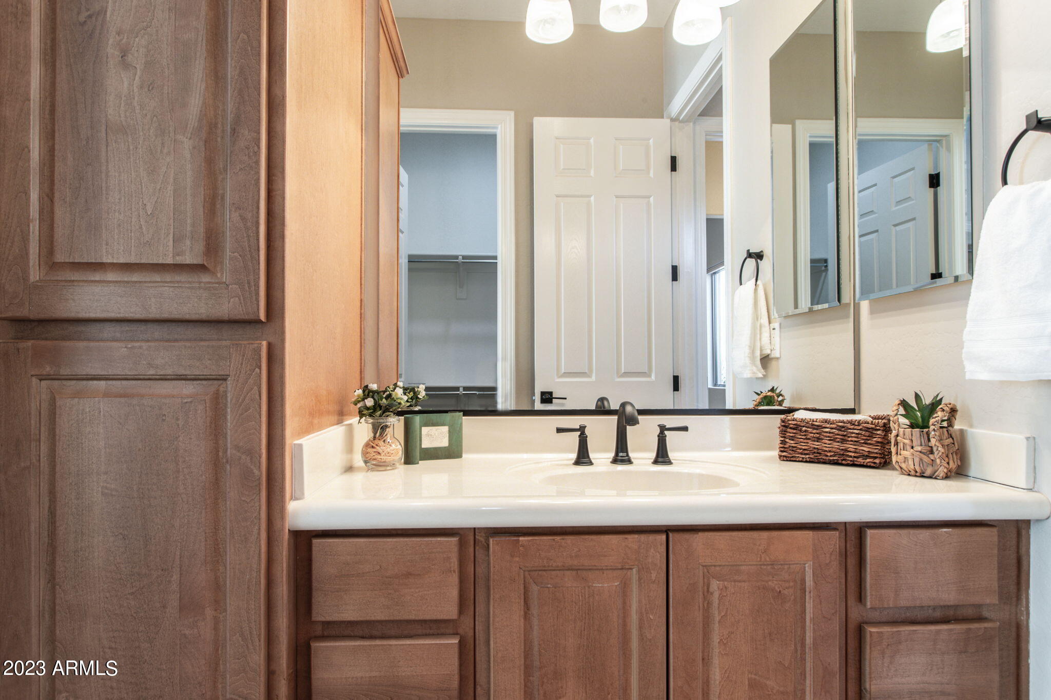 42409 North Back Creek Way Anthem, AZ 85086 - Photo 37 of 87 a bathroom with a double vanity sink and a mirror