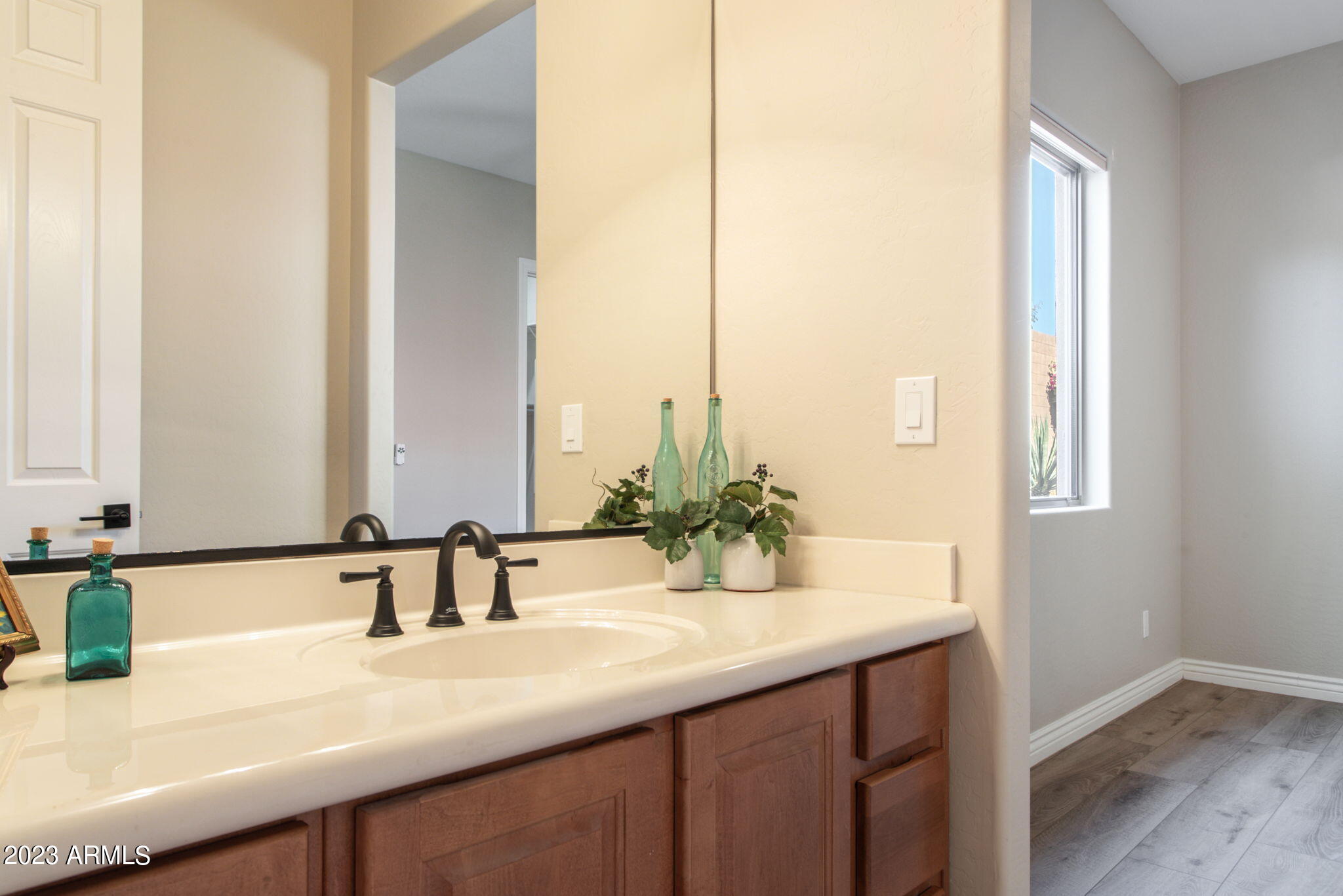 42409 North Back Creek Way Anthem, AZ 85086 - Photo 39 of 87 a bathroom with a sink and a mirror