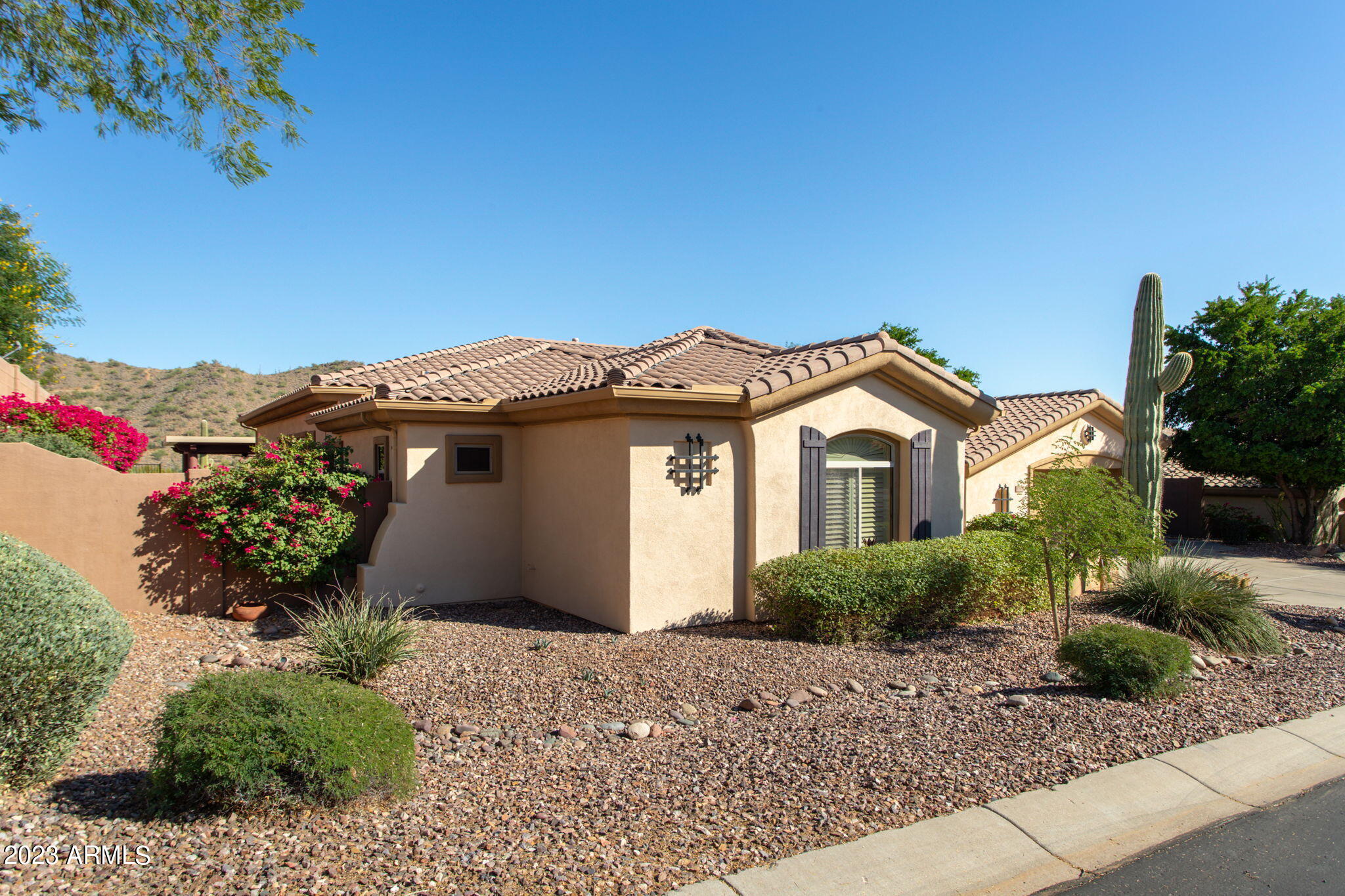 42409 North Back Creek Way Anthem, AZ 85086 - Photo 45 of 87 a front view of a house with a yard and garage