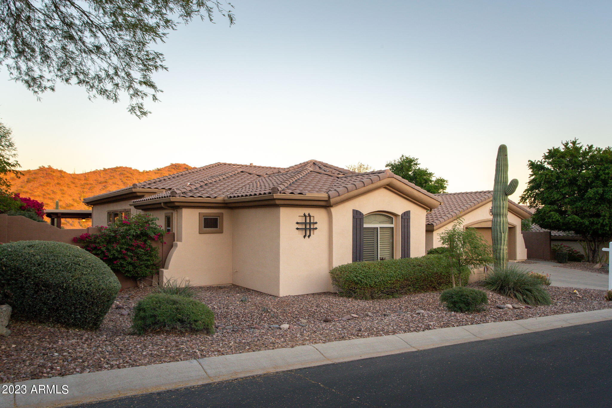 42409 North Back Creek Way Anthem, AZ 85086 - Photo 46 of 87 a view of a house with a yard and large tree
