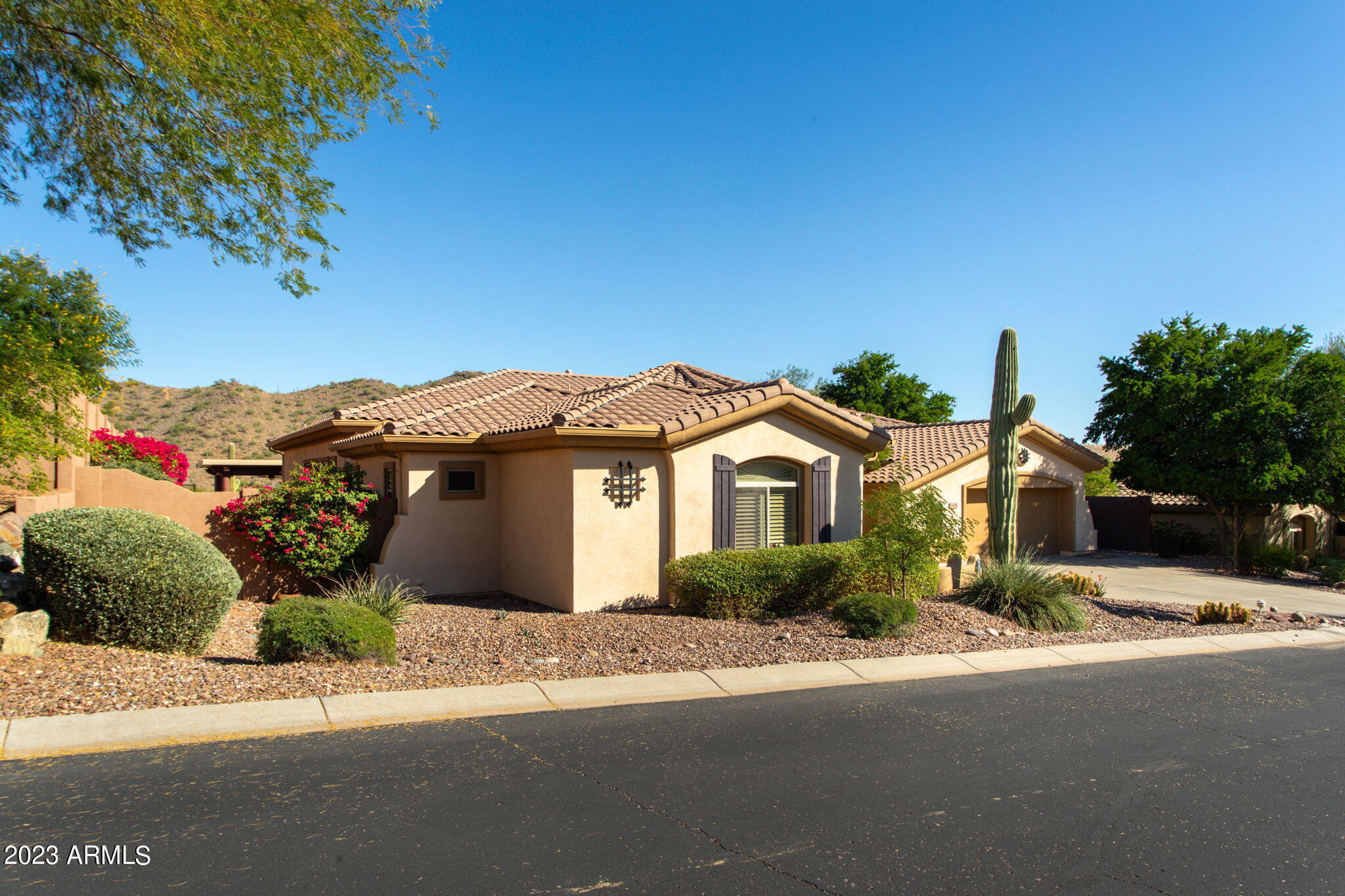 42409 North Back Creek Way Anthem, AZ 85086 - Photo 47 of 87 a front view of a house with a yard and garage