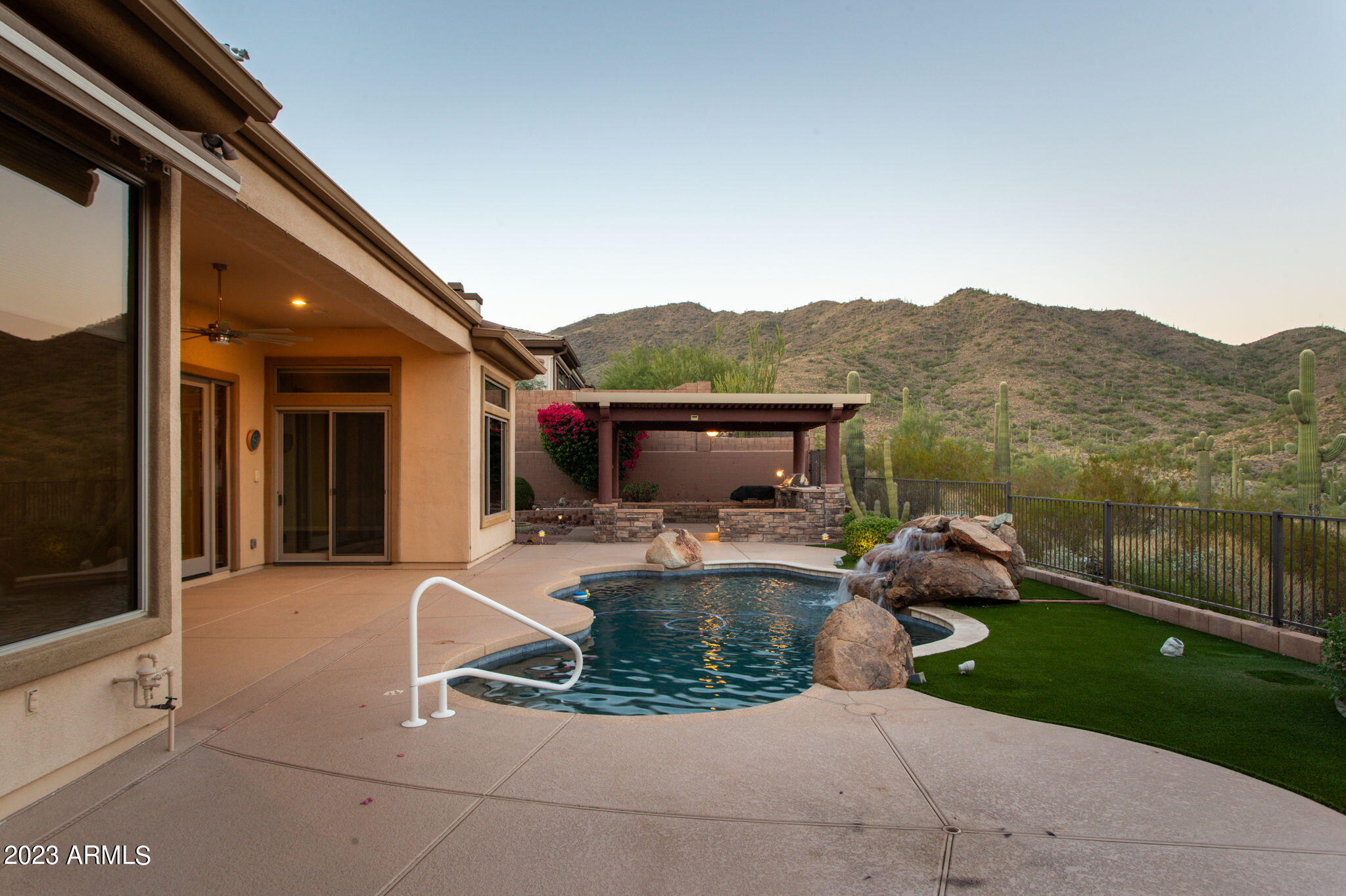42409 North Back Creek Way Anthem, AZ 85086 - Photo 53 of 87 a view of a house with backyard sitting area and garden