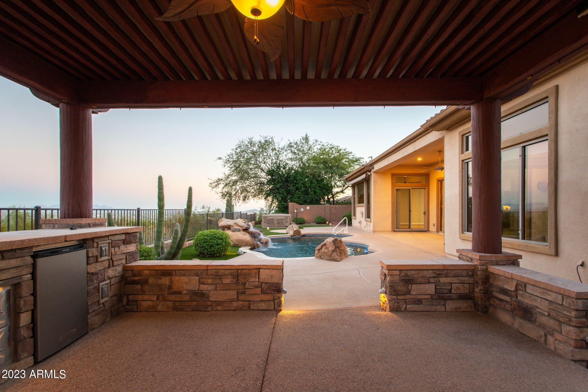 42409 North Back Creek Way Anthem, AZ 85086 - Photo 6 of 87 a building outdoor space with patio furniture and potted plants