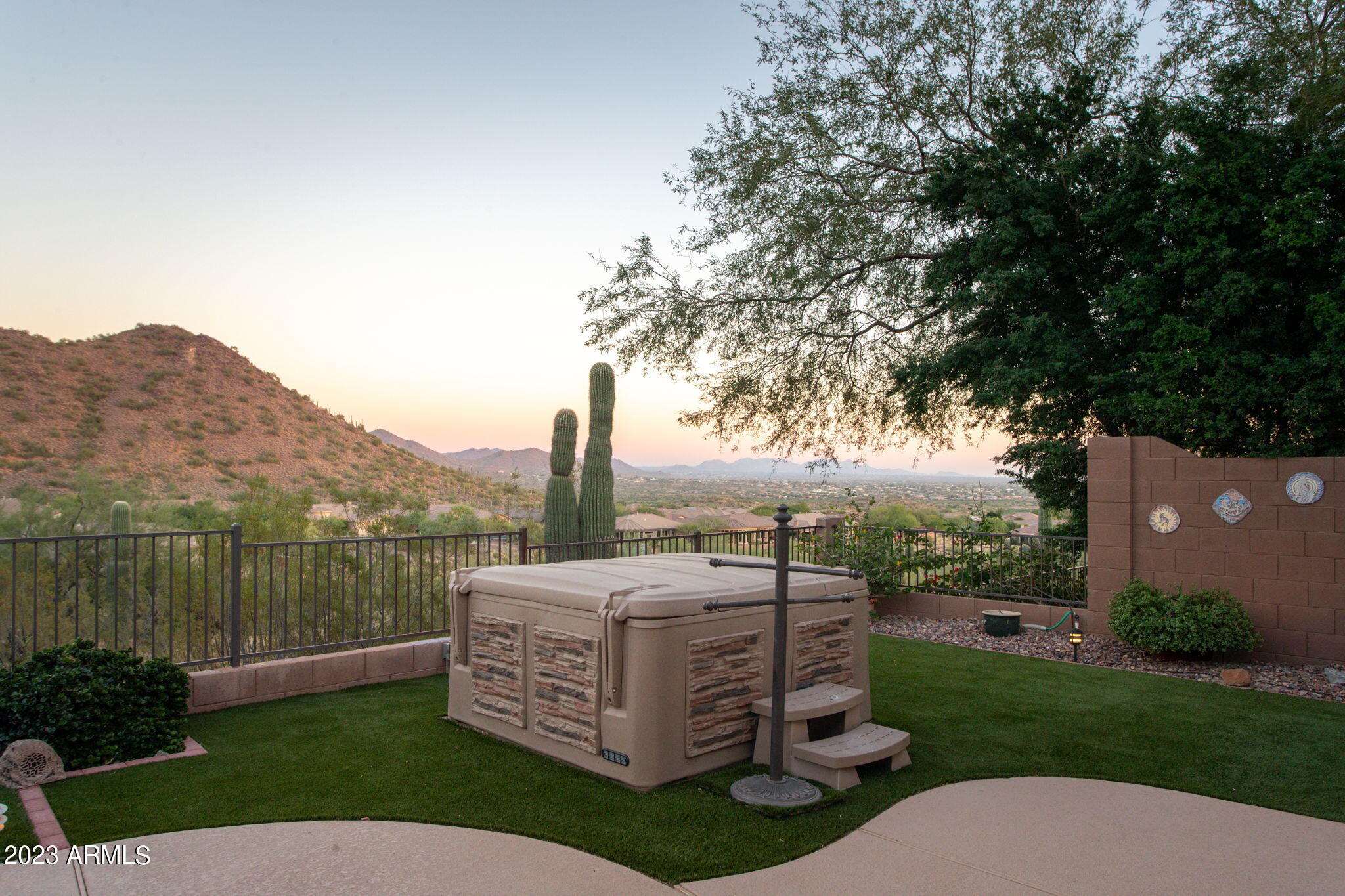 42409 North Back Creek Way Anthem, AZ 85086 - Photo 69 of 87 a view of a garden with a bench in the background