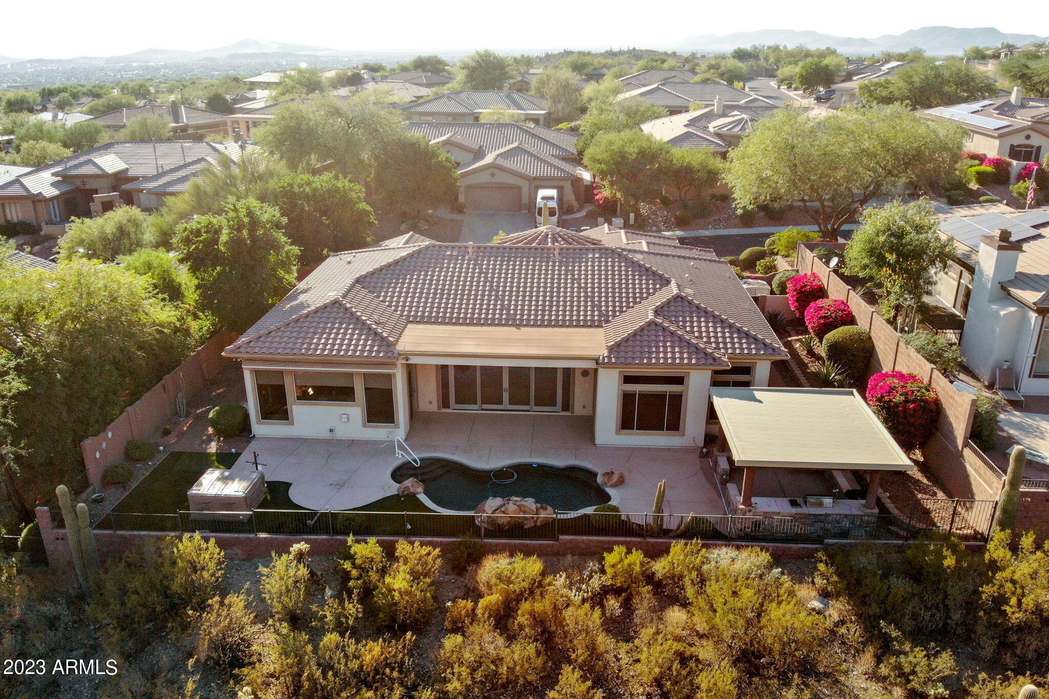 42409 North Back Creek Way Anthem, AZ 85086 - Photo 80 of 87 an aerial view of a house with swimming pool and mountains