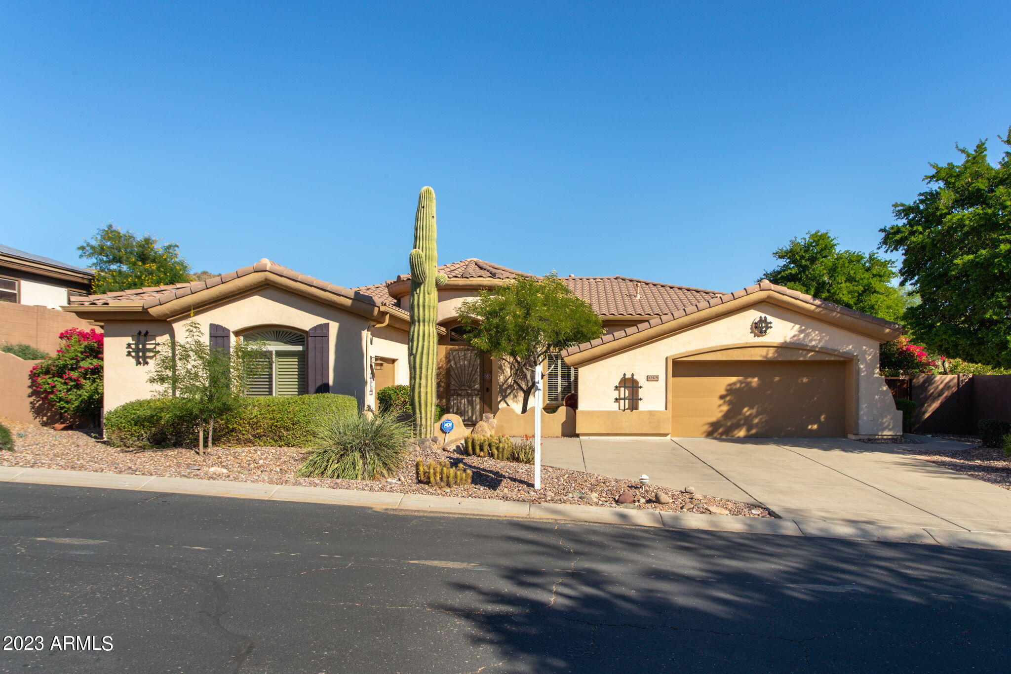 42409 North Back Creek Way Anthem, AZ 85086 - Photo 8 of 87 a front view of a house with a yard and garage