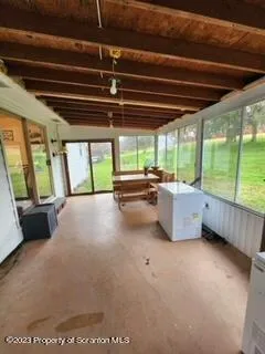 a view of an empty room with a balcony