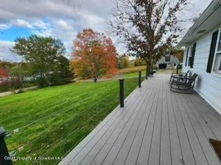 a view of a backyard with sitting area