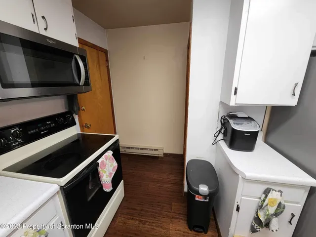 a kitchen with a stove and a microwave
