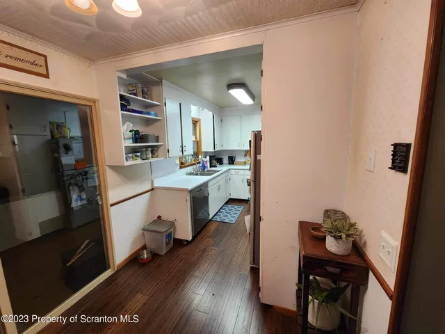 a room with furniture and a wooden floor