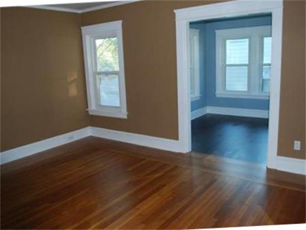 1010 County Road Barrington, RI 02806 - Photo 6 of 17 a view of an empty room with wooden floor and a window