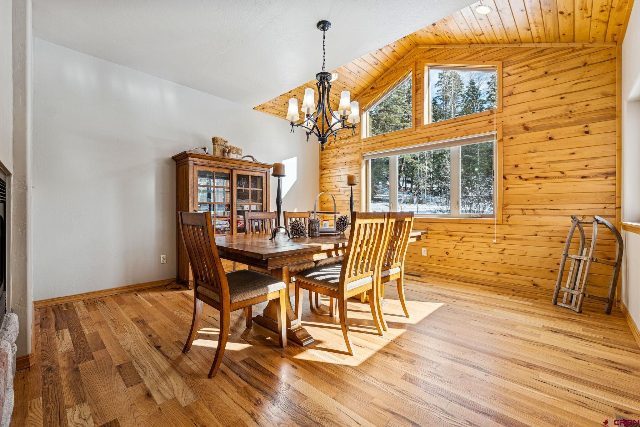 191 Aspen Drive Durango, CO 81301 - Photo 13 of 43 a view of a dining room with furniture and wooden floor