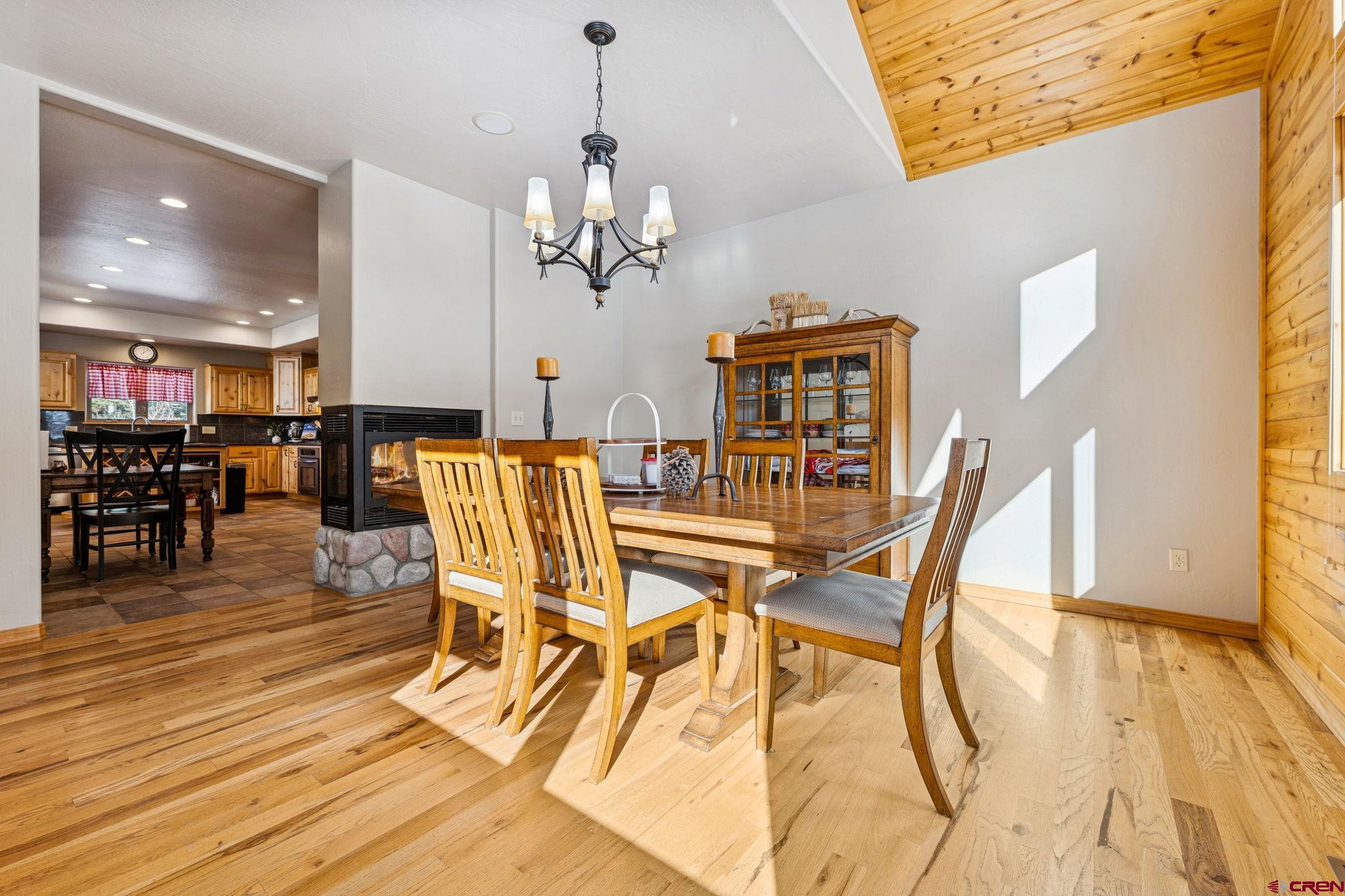 191 Aspen Drive Durango, CO 81301 - Photo 14 of 43 a view of a dining room with furniture and wooden floor