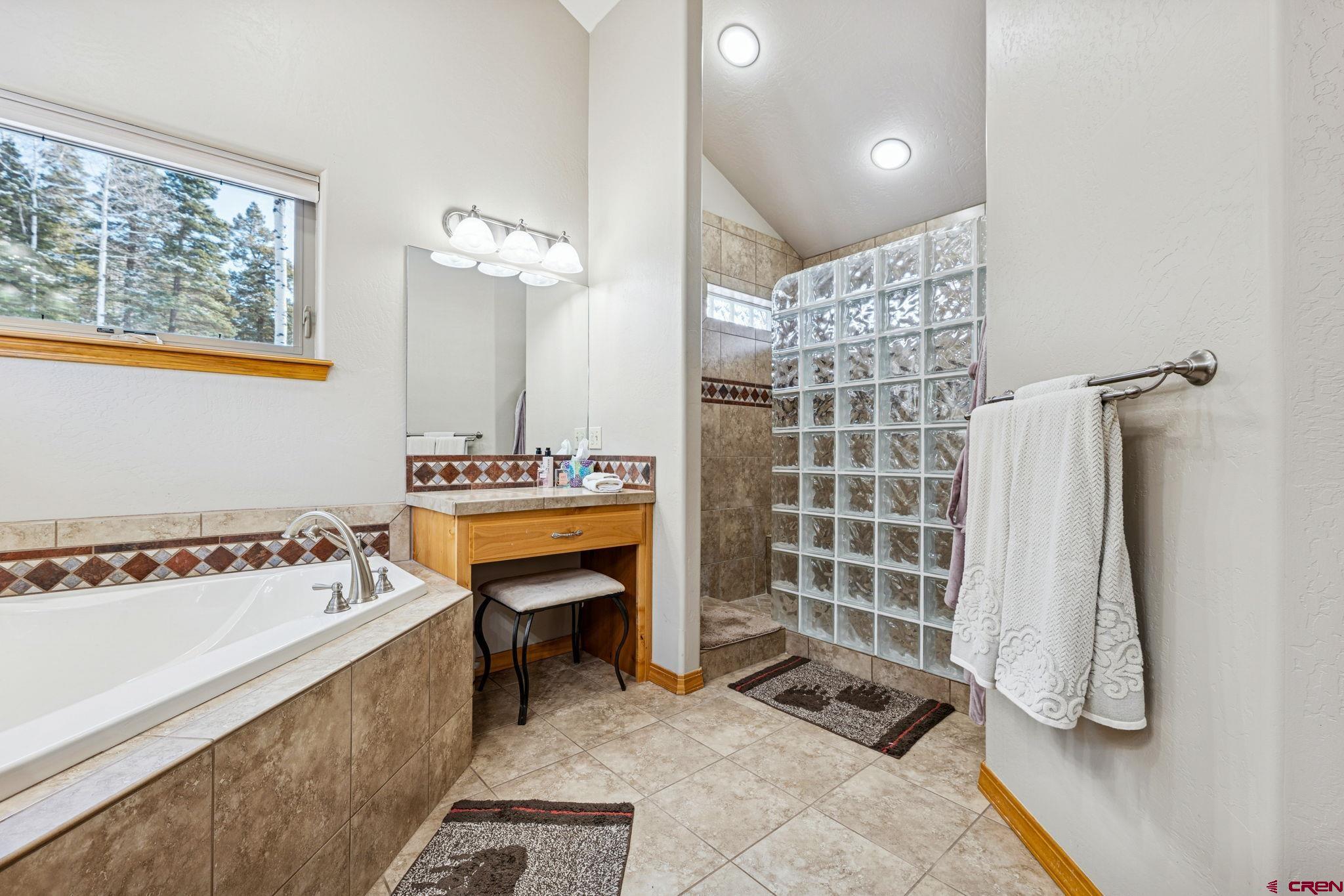 191 Aspen Drive Durango, CO 81301 - Photo 19 of 43 a bathroom with a tub sink and mirror