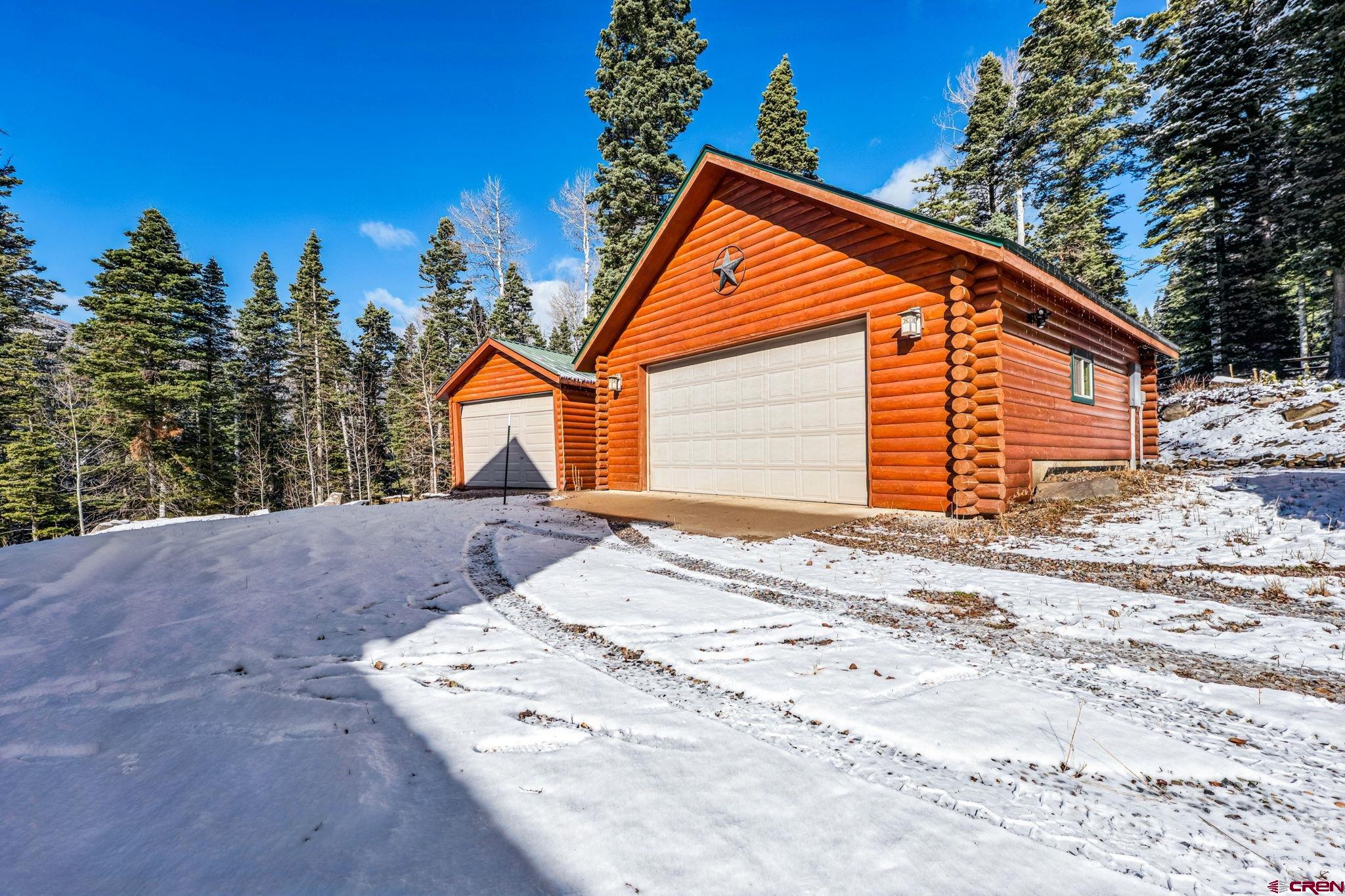 191 Aspen Drive Durango, CO 81301 - Photo 31 of 43 a backyard of a house with large trees