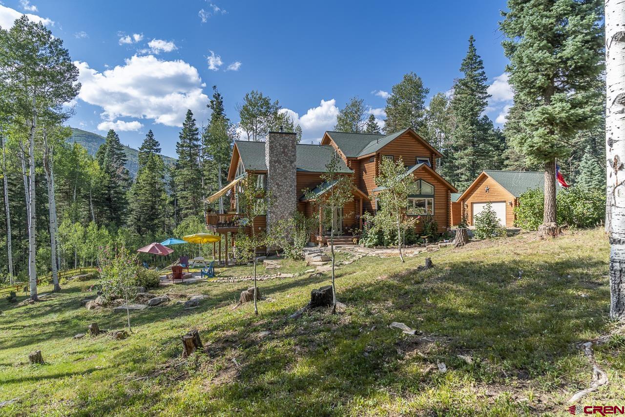 191 Aspen Drive Durango, CO 81301 - Photo 43 of 43 a front view of a house with a yard and garage