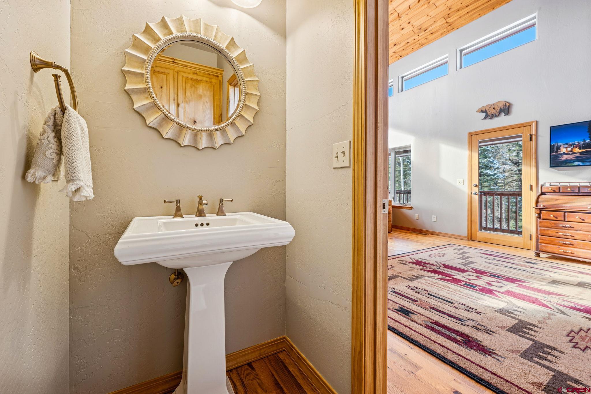 191 Aspen Drive Durango, CO 81301 - Photo 10 of 43 a bathroom with a sink and a mirror