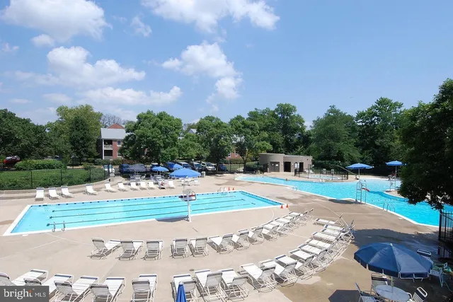 a yellow house with lots of flowers