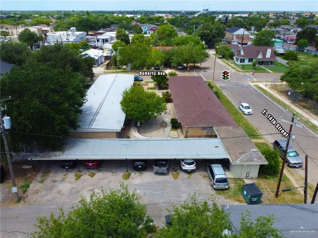 an aerial view of a house with a swimming pool