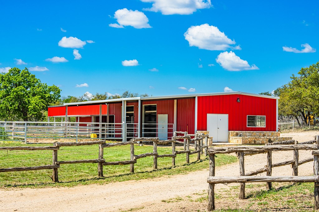 1379 Barker Rogers Road Harper, TX 78631 - Photo 11 of 32 a view of a brick house with a street