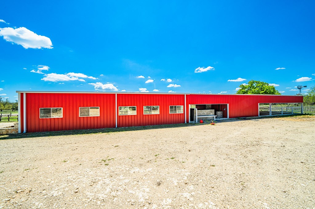 1379 Barker Rogers Road Harper, TX 78631 - Photo 12 of 32 a front view of a building with yard