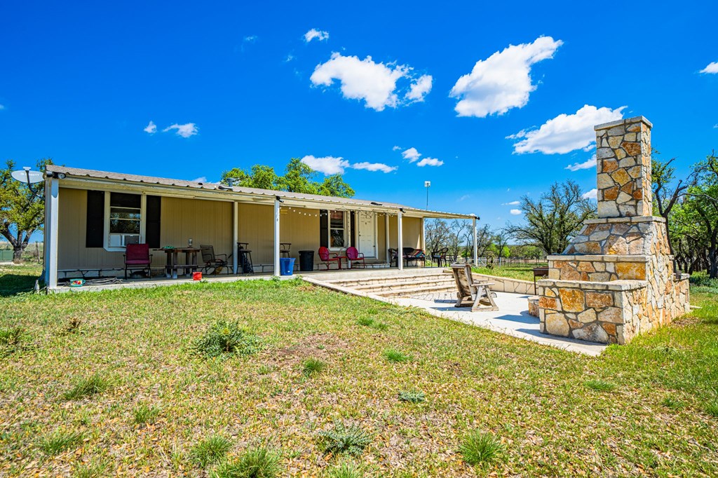 1379 Barker Rogers Road Harper, TX 78631 - Photo 19 of 32 a view of a house with backyard and sitting area