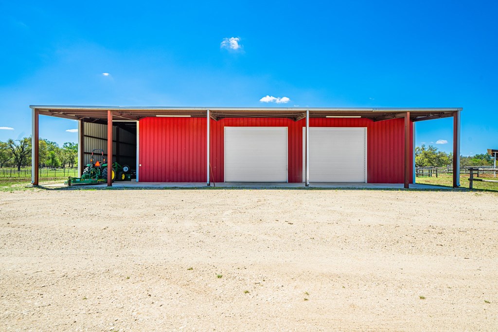 1379 Barker Rogers Road Harper, TX 78631 - Photo 8 of 32 a view of building with yard