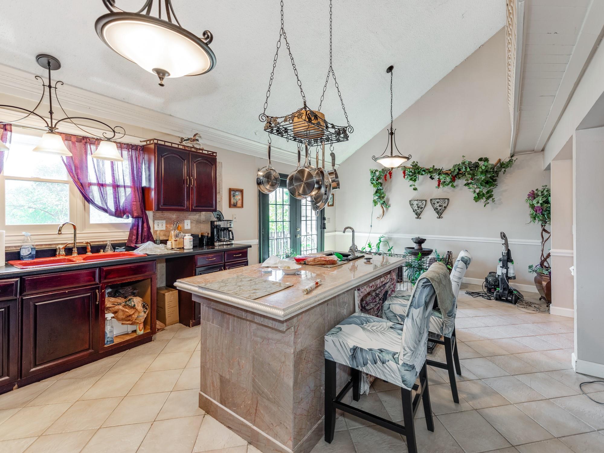 2429 Dellinger Circle Charlotte, NC 28269 - Photo 15 of 40 a view of a dining room with furniture and a chandelier