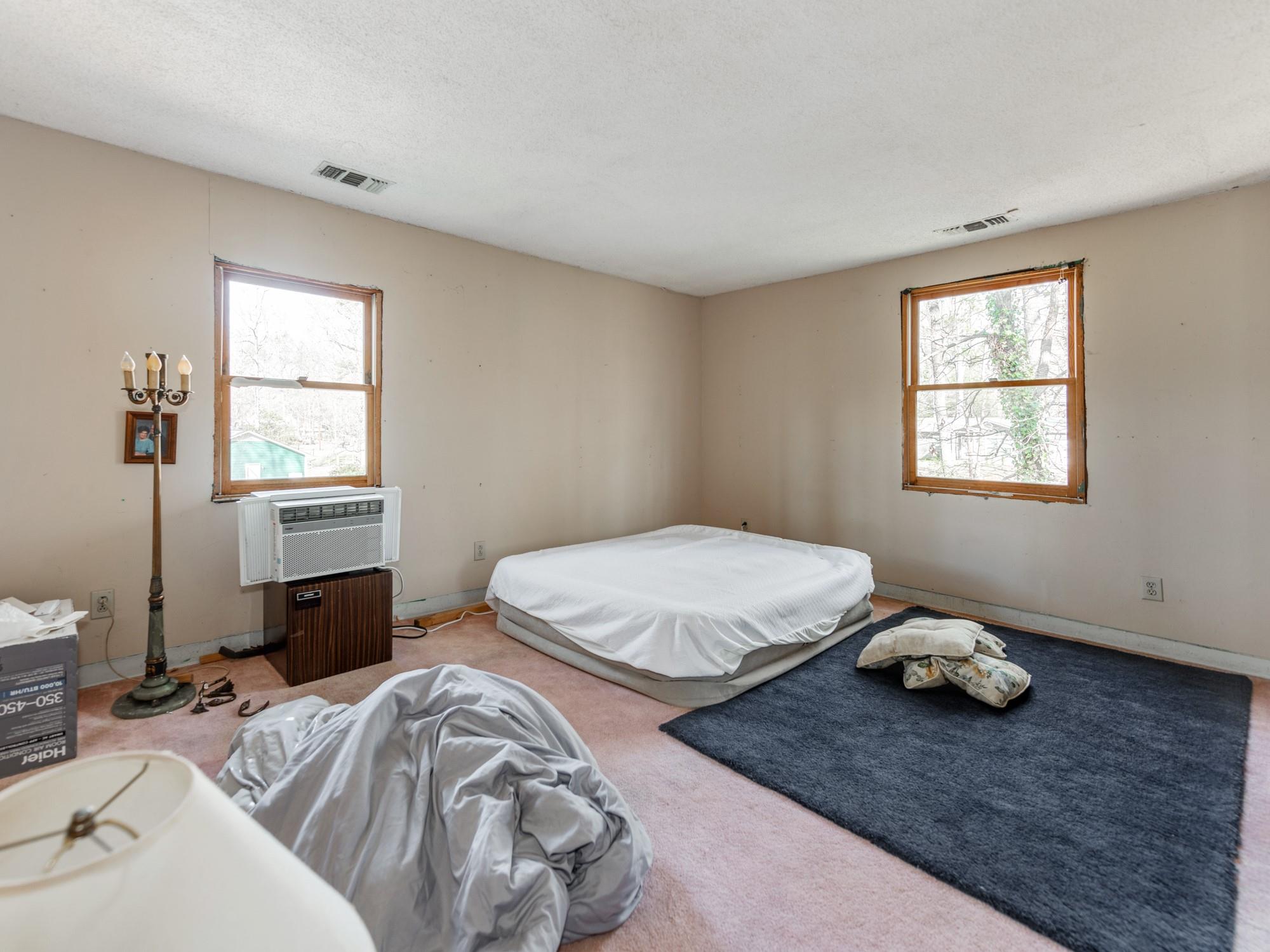 2429 Dellinger Circle Charlotte, NC 28269 - Photo 26 of 40 a bedroom with two beds and a window
