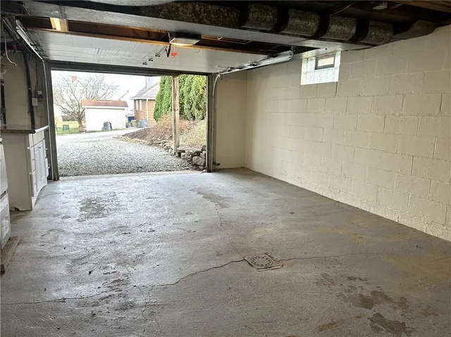 a view of a house with a yard and garage