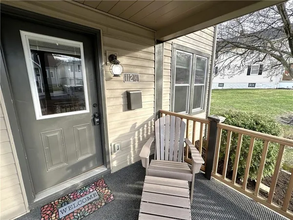 a view of a house with wooden floor and a yard