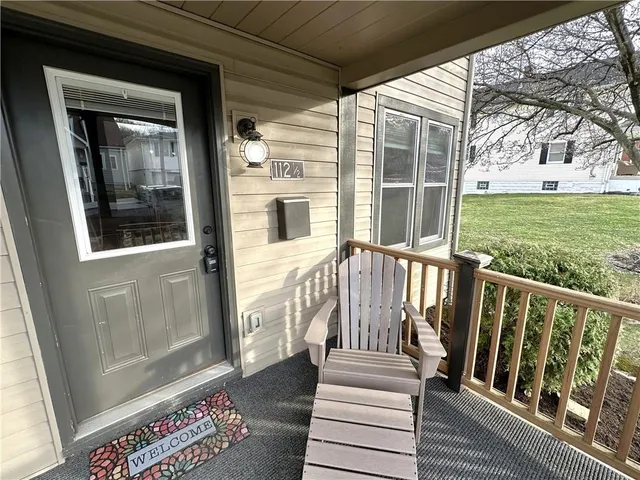 a view of a house with wooden floor and a yard