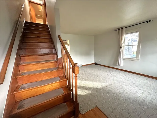 a kitchen with refrigerator cabinets and window
