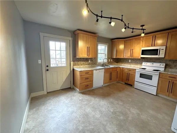 a view of a back yard of the house