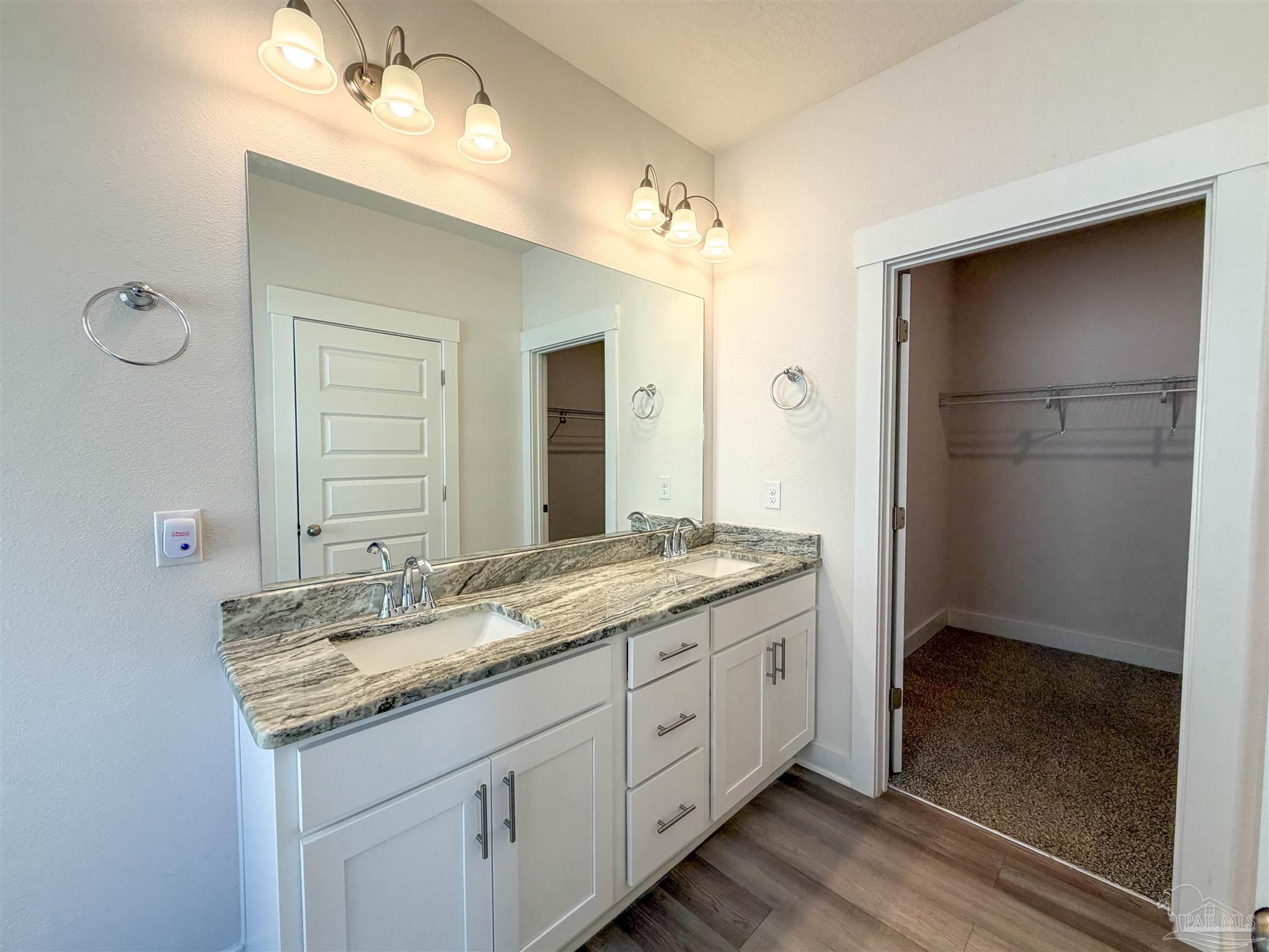 7429 Jamesville Road Pensacola, FL 32526 - Photo 11 of 24 a bathroom with a granite countertop sink shower and a mirror