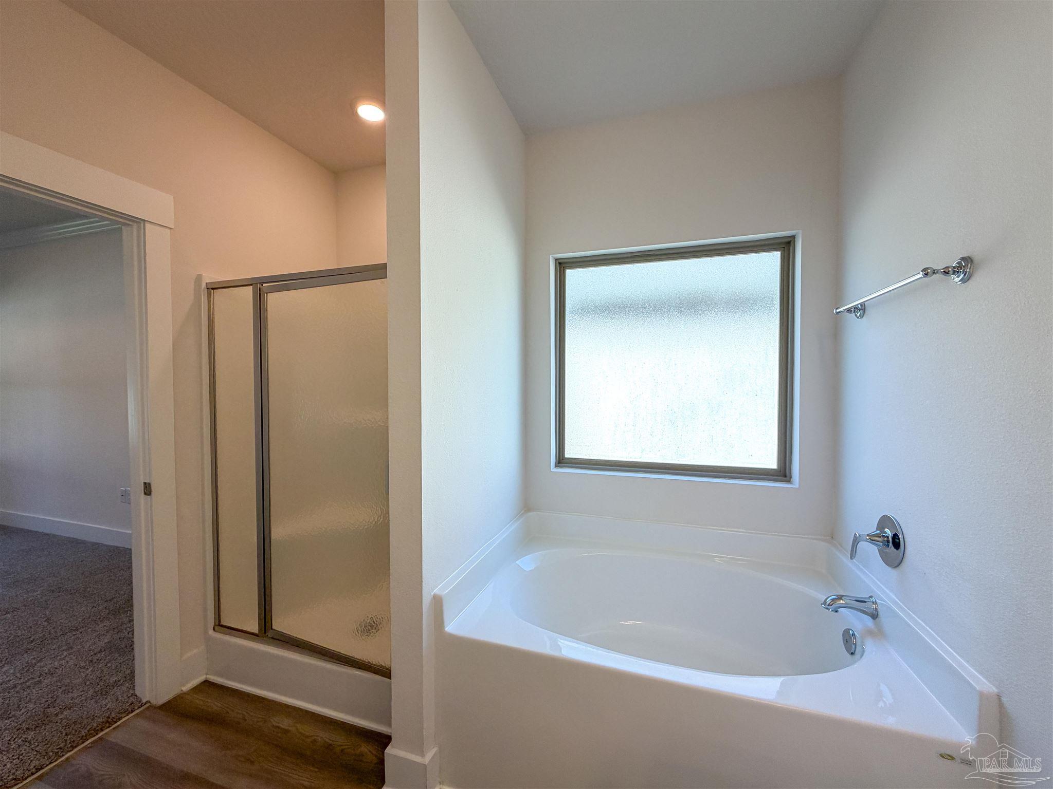 7429 Jamesville Road Pensacola, FL 32526 - Photo 12 of 24 a white bath tub sitting next to a shower