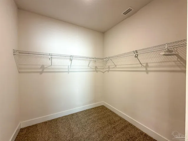 a view of a room with racks on the wall