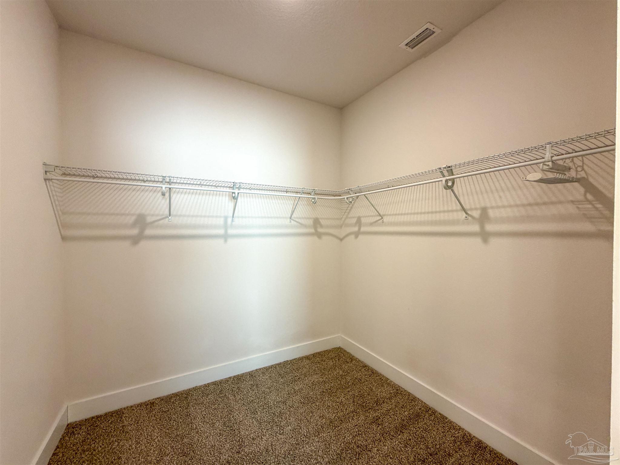 7429 Jamesville Road Pensacola, FL 32526 - Photo 13 of 24 a view of a room with racks on the wall