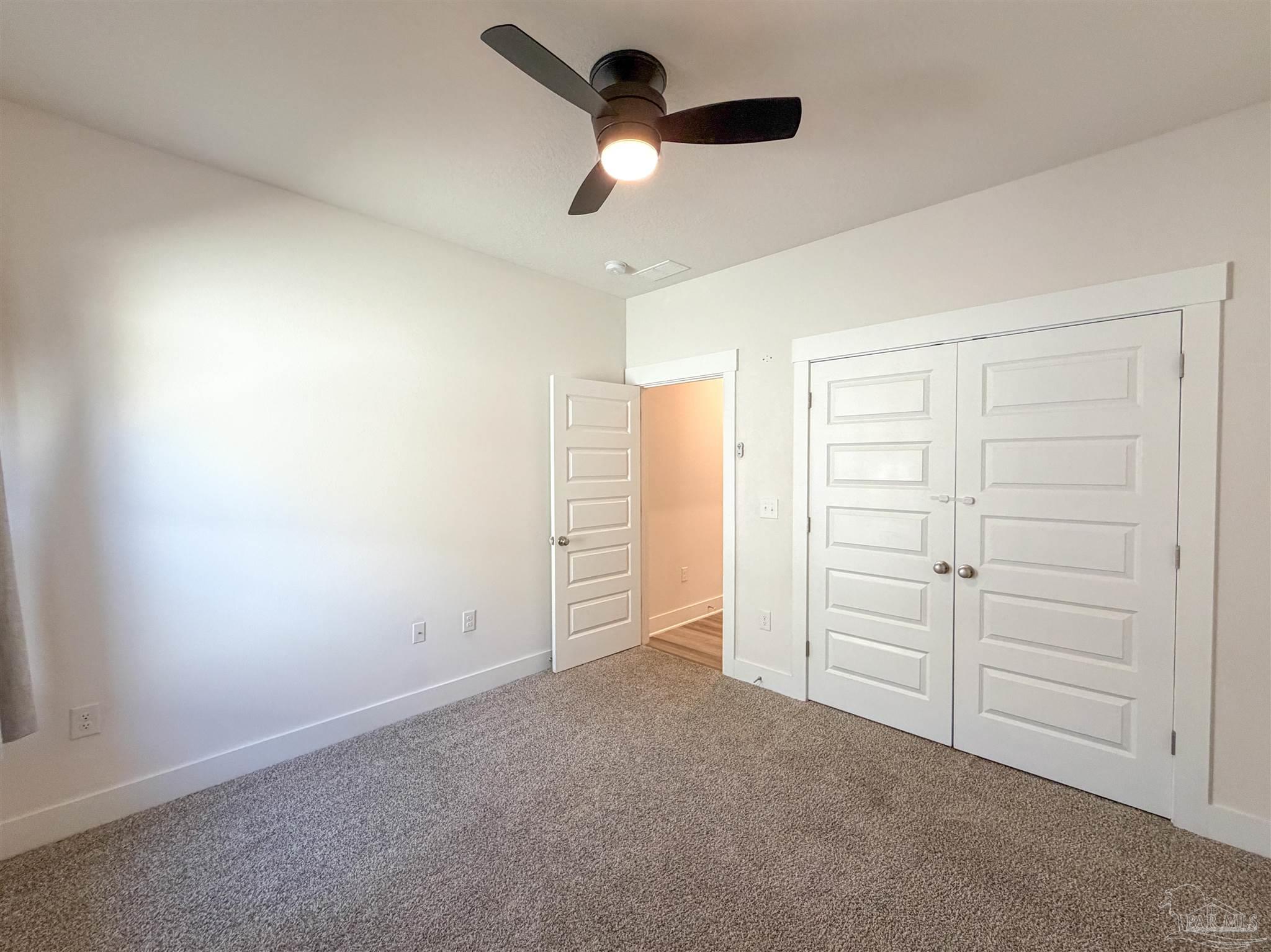 7429 Jamesville Road Pensacola, FL 32526 - Photo 16 of 24 wooden floor in an empty room