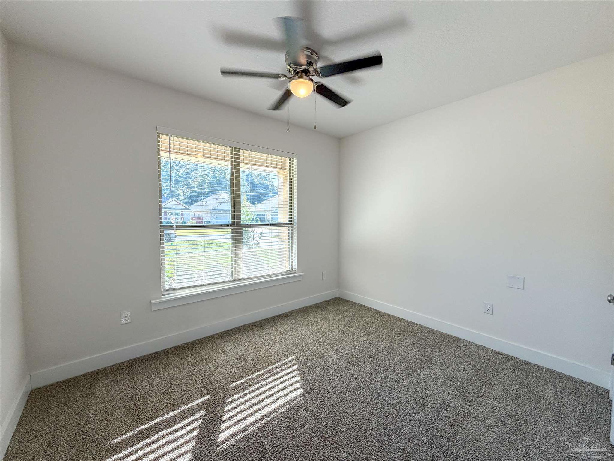 7429 Jamesville Road Pensacola, FL 32526 - Photo 21 of 24 an empty room with a window