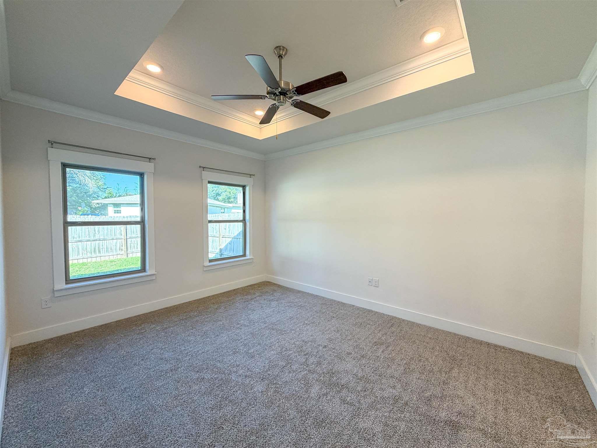 7429 Jamesville Road Pensacola, FL 32526 - Photo 8 of 24 an empty room with a window and a fan