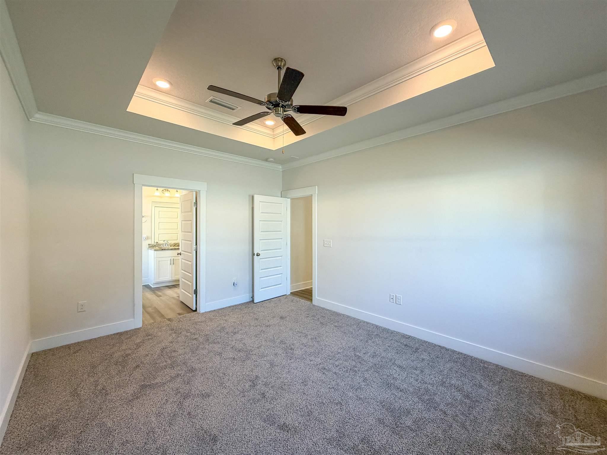 7429 Jamesville Road Pensacola, FL 32526 - Photo 9 of 24 en empty room with windows and fan