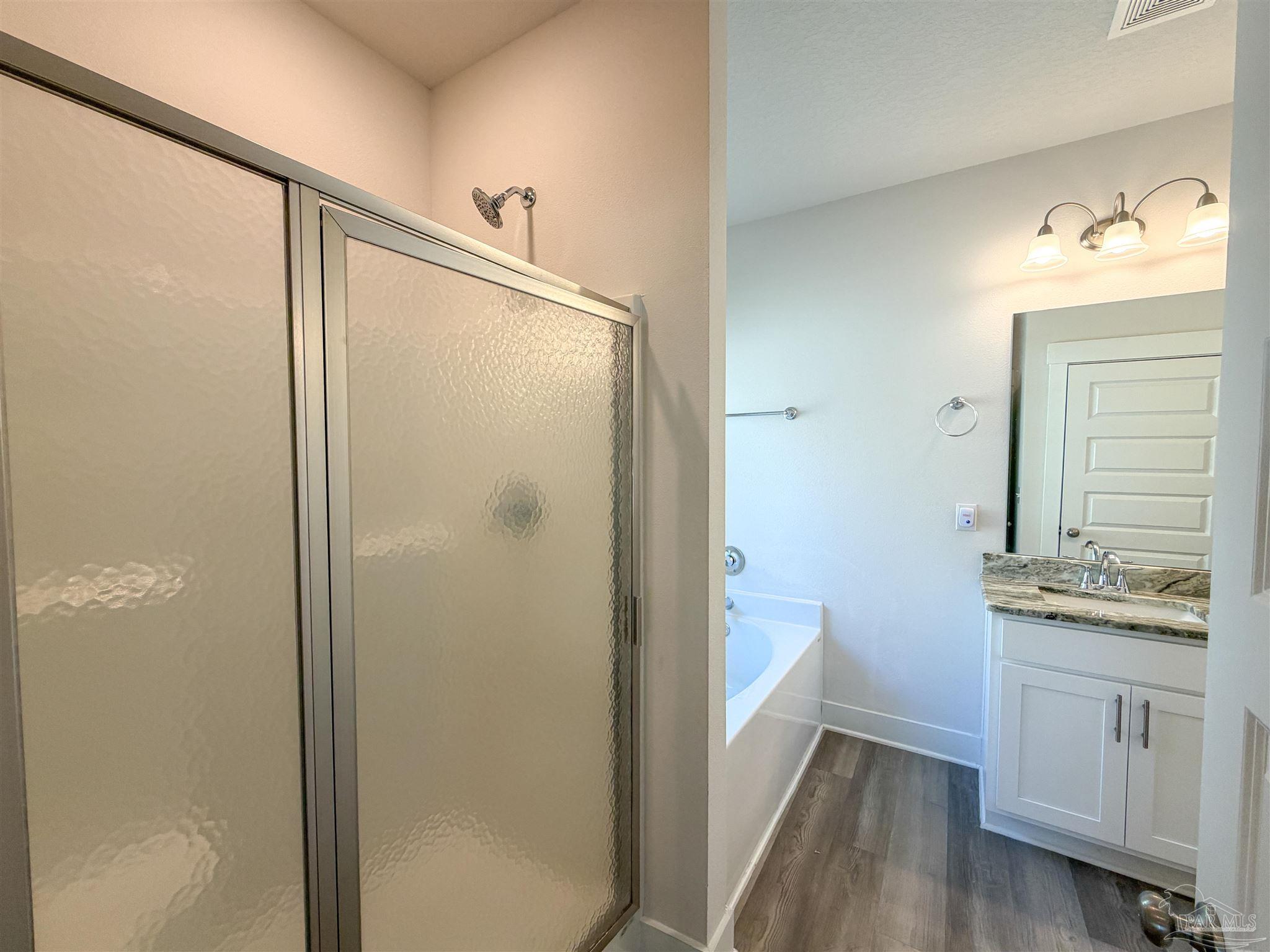 7429 Jamesville Road Pensacola, FL 32526 - Photo 10 of 24 a bathroom with a granite countertop sink toilet and shower