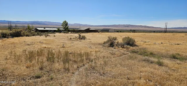 a view of a lake with houses in the back