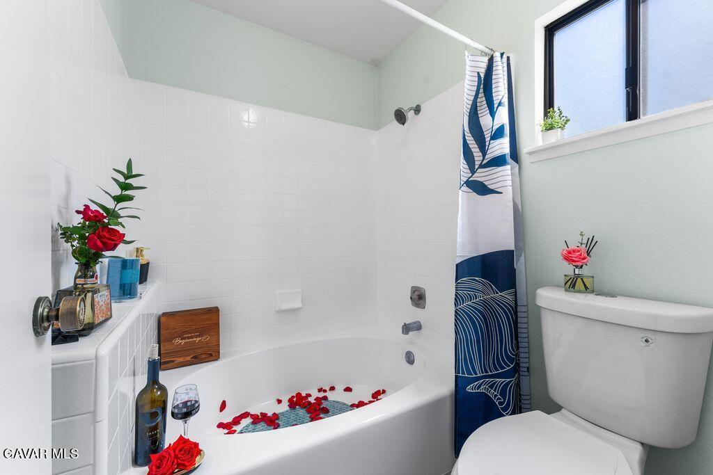 44246 Ruthron Avenue Lancaster, CA 93536 - Photo 20 of 31 a bathroom with a sink mirror vanity and toilet