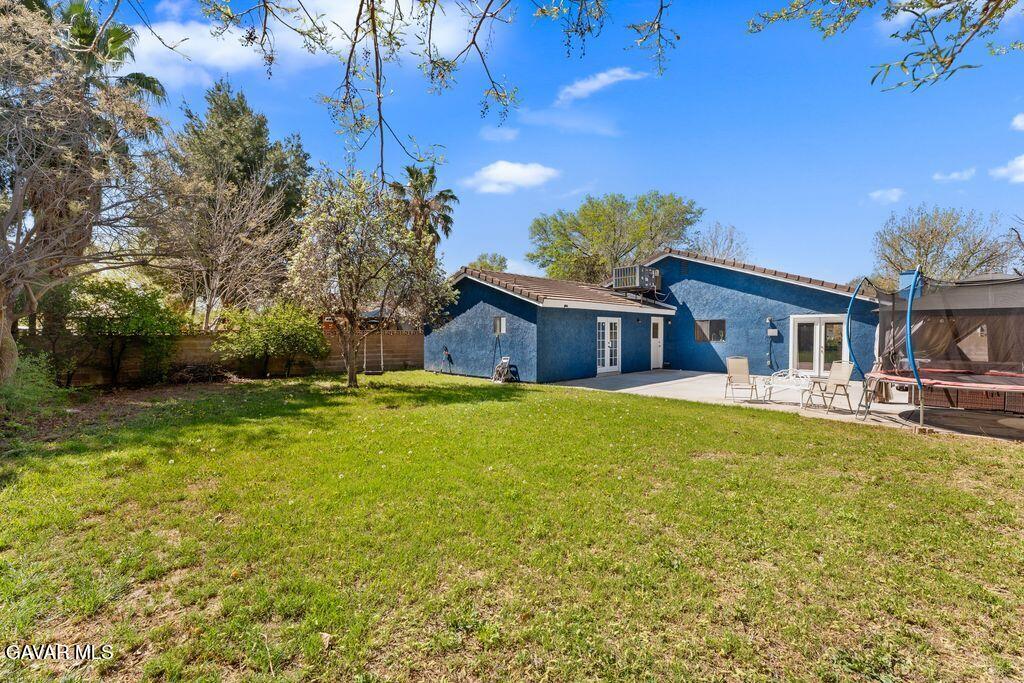 44246 Ruthron Avenue Lancaster, CA 93536 - Photo 28 of 31 a swimming pool with outdoor seating