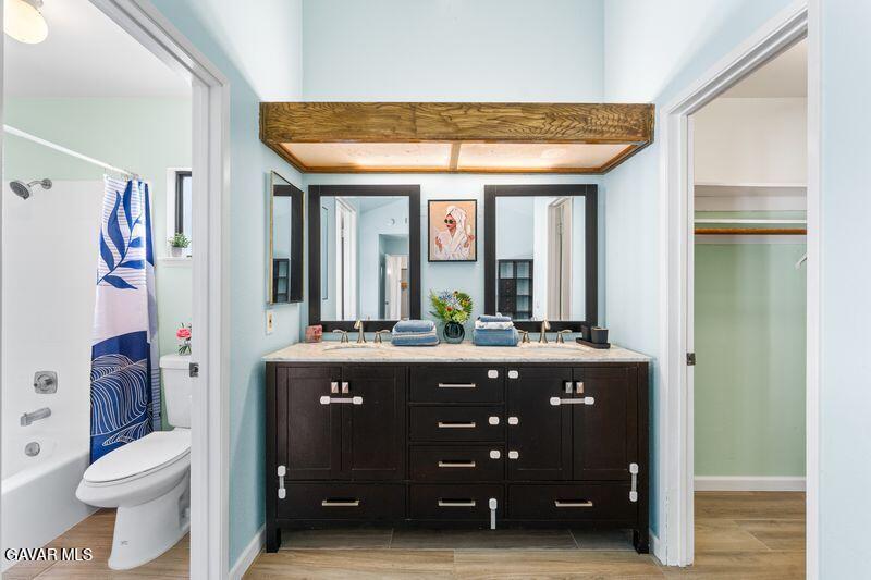 44246 Ruthron Avenue Lancaster, CA 93536 - Photo 7 of 31 a spacious bathroom with a granite countertop sink a toilet and a tub