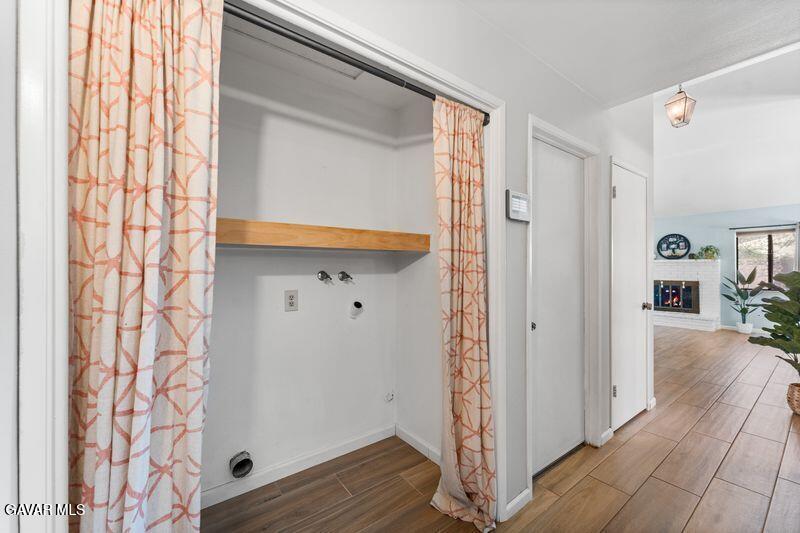 44246 Ruthron Avenue Lancaster, CA 93536 - Photo 9 of 31 a view of livingroom with hardwood floor and hallway